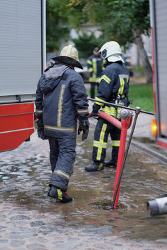 Members of the fire brigade at the hydrant of water supply