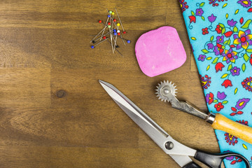 sewing accessories with scissors, tailor's chalk and pins