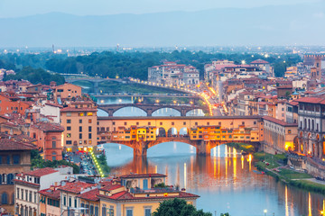 River Arno and famous bridge Ponte Vecchio at twilight from Piazzale Michelangelo in Florence,...