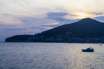 Sea view evening. Soltsev descended the hill. The ship is in the roadstead. Montenegro. Budva