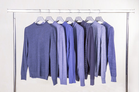 blue jumpers on the hanger in the store