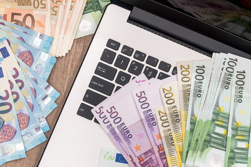 euro money on laptop. close up