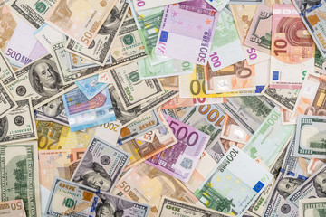 Obraz na płótnie Canvas pile of dollar and euro banknote as background
