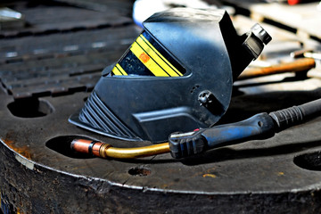 Industrial Worker labourer at the factory welding steel structure
