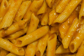 A cooked macaroni dish with bolognese