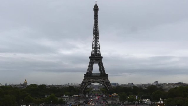 Iconic time lapse of crowded Champ de Mars and the Eiffel tower in Paris, France