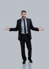 Surprised emotional businessman posing on a white background