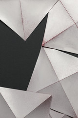 White paper sheets folded in geometric shapes