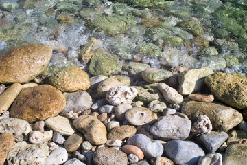 Stones on the seashore and in the water