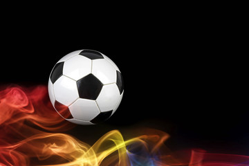 Naklejka premium Soccer ball in falames
