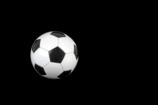 Soccer ball isolated on black background