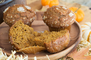 Delicious Pumpkin Muffins on a Wooden Plate