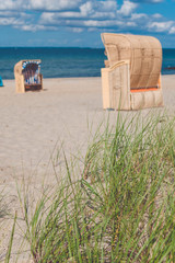 Sandy beach and traditional wooden beach chairs. Northern Germany, on the coast of Baltic Sea