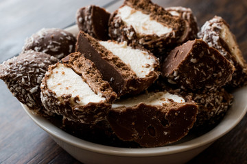 Chocolate Covered Marshmallows with Coconut Powder.
