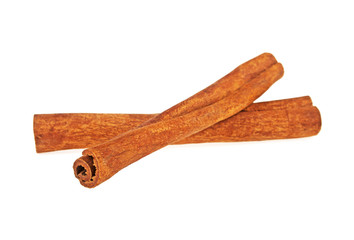 Two cinnamon sticks isolated on white background