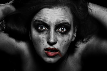 sad woman with smeared cosmetics on dark background