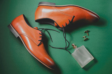 Brown leather executive shoes with perfume