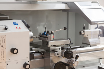 Fitter working at Turning machine in metal workshop