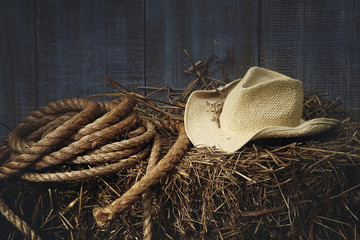 Western straw hat on a bale of hay