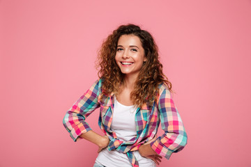 Portrait of woman laughing isolated over pink