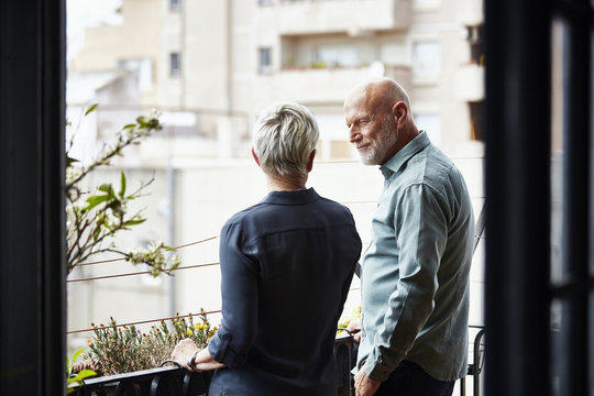 Senior Couple Conversing On Balcony