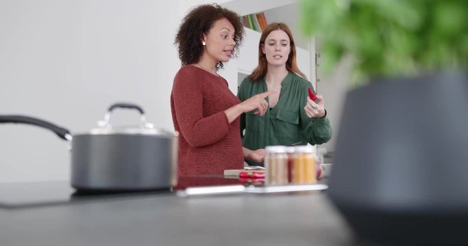 Adult female picking chilli for her recipe