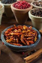 Red hot chili pepper dried on wooden background
