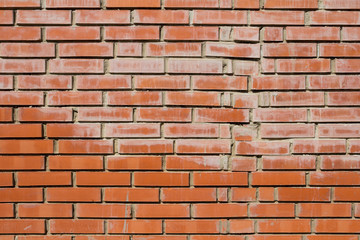 Brick wall close-up. New red brick wall background