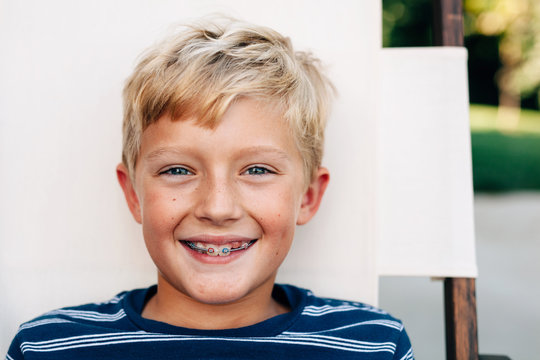 Portrait Of A Smiling, Happy Boy With Braces