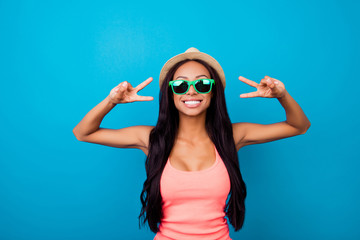 Peace to all! V gesture with fingers of arm of attractive, excited carefree gorgeous traveller in trendy shiny specs, long dark hair, in singlet, so hot, fit and slim, relax, rest, chill mode!