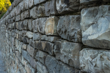 Closeup of old stone wall use for construction business and designers