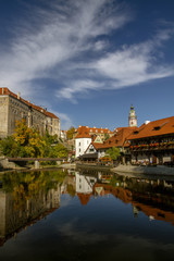 Naklejka premium Cesky Krumlov, view on Vltava river and castle reflected in water in the sunny day. Czech Republic.Historical city. UNESCO World Heritage. 