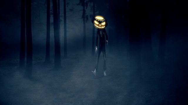 Terrifying Jack O Lantern / Pumpkin Man walking in a foggy forest at night in Halloween. 4K UHD animation rendered at 16-bit color depth. Broadcast quality.