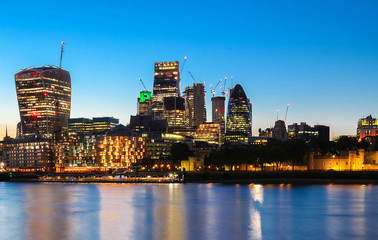 The view of London's city hall and modern skyscrapers at night