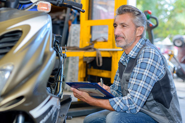 inspecting the motorbike