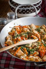 Fried chicken pieces with vegetables.