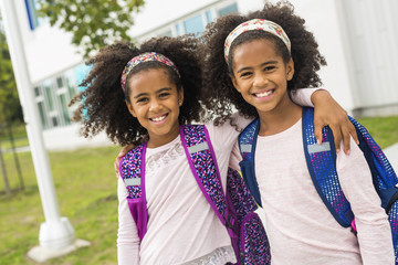 Two nine years old girl student at school