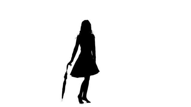Lady with an umbrella in her hands is dancing. White background. Silhouette