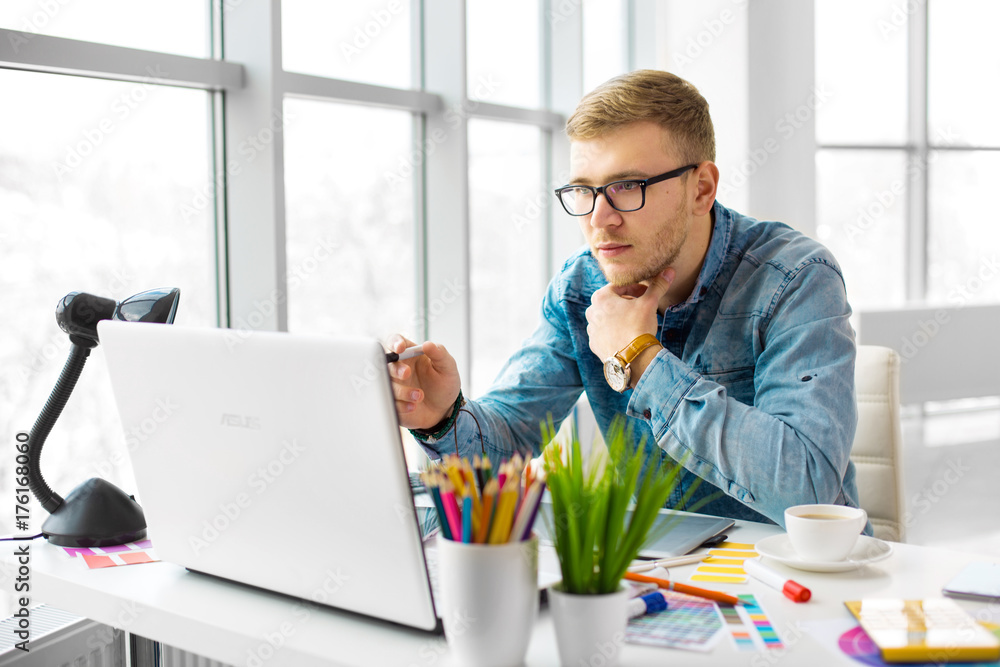 Poster web designer working on the best framework of a new application