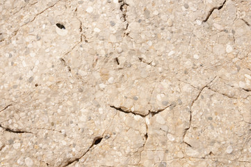Cracked rock built from small stones. 