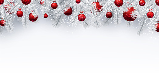 Christmas background with spruce branches and balls.