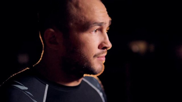 A close-up view on a bearded fighters face. 