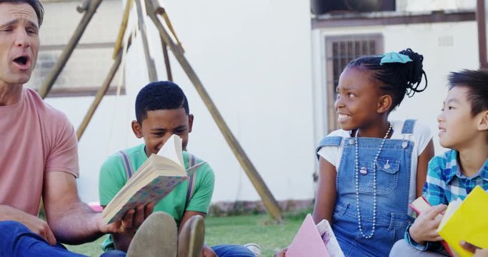 Man teaching kids in the backyard of house 