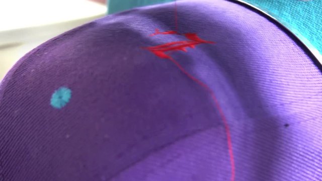 Industrial Embroidery Machine Embroidering Hat, closeup