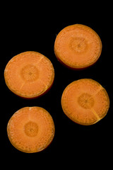 Carrot Slices on Black Background