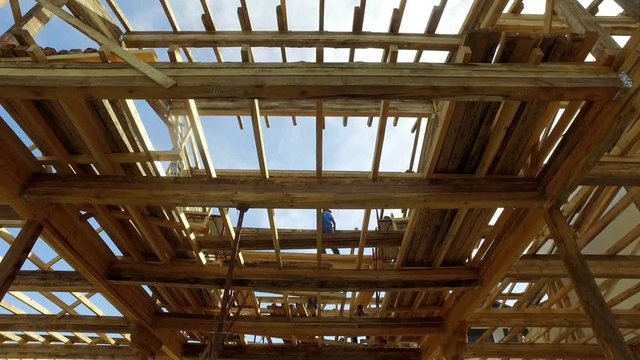 Your dream home. New residential construction house framing against a 