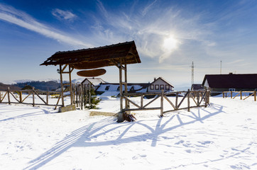 Mountain winter complex with wooden entrance door