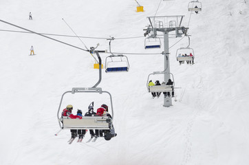 Skiers go on the lift on mountain in Bansko, Bulgaria