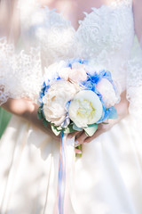 Bride holding wedding bouquet on wedding ceremony