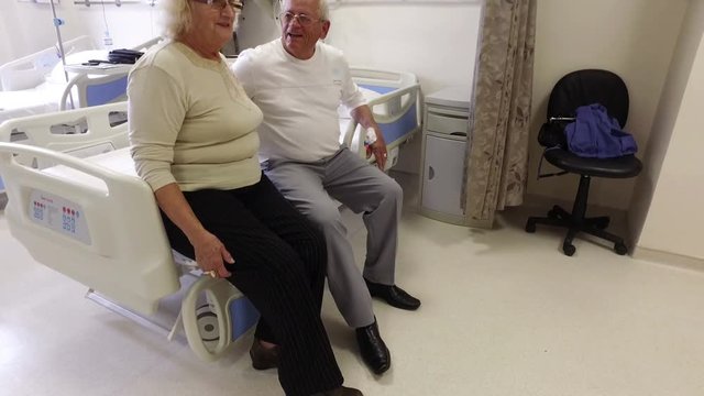 Anxious senior wife giving her sick husband courage before operation 